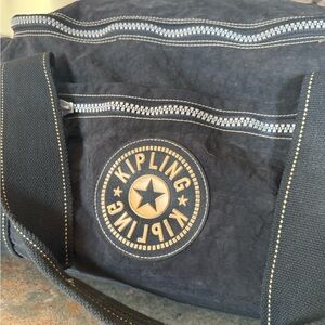 Kipling Navy Canvas Duffel with Beige Badge Accents